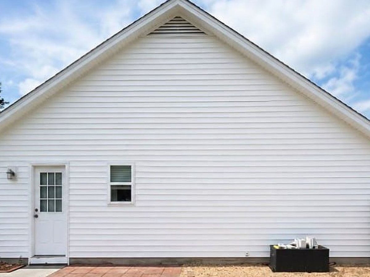 After: new white vinyl siding
